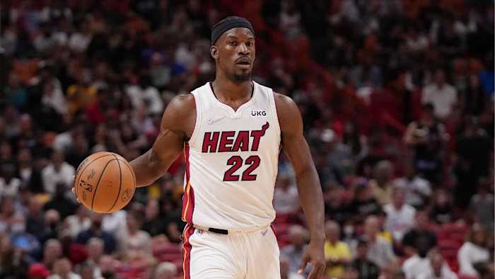 Mar 23, 2022; Miami, Florida, USA; Miami Heat forward Jimmy Butler (22) dribbles the ball up the court against the Golden State Warriors during the first half at FTX Arena. Mandatory Credit: Jasen Vinlove-USA TODAY Sports